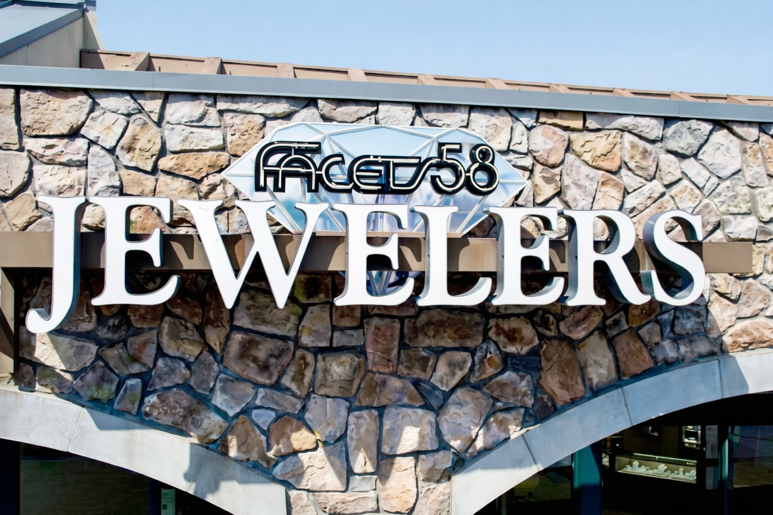 Facets 58 Fine Jewelers storefront at Seacliff Shopping Center in Huntington Beach